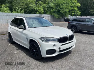 2014 BMW X5 xDrive50i with VIN 5UXKR6C58E0J71917, listed as a Copart auction lot 63424205 with 100,063 mi miles and Clean title. Bid and sale history available at DreamBid. Image 1.
