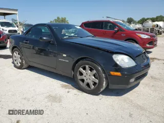 1999 Mercedes-Benz SLK-Class with VIN WDBKK47F5XF129037, listed as a Copart auction lot 68842504 with 74,397 mi miles and Salvage Title. Bid and sale history available at carsss.com. Image 4.