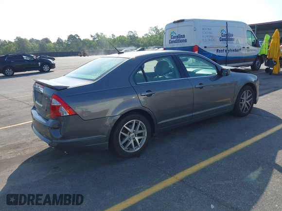 2011 Ford Fusion SEL with VIN 3FAHP0JAXBR295414, listed as a IAAI auction lot 41984604 with 164,909 mi miles. Bid and sale history available at carsss.com. Image 4.