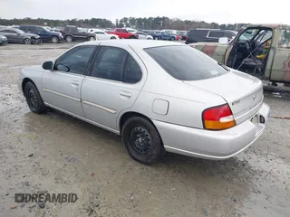 1999 Nissan Altima XE with VIN 1N4DL01D5XC180276, listed as a IAAI auction lot 41584645 with 248,376 mi miles. Bid and sale history available at carsss.com. Image 3.