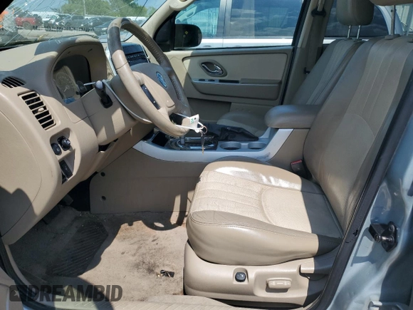 2005 Mercury Mariner Luxury z VIN 4M2YU57155DJ28005, wystawiony jako Copart lot #63460344 z przebiegiem 131 531 mil mil oraz Szkody całkowita. Historia ofert i sprzedaży dostępna na DreamBid. Obrazek 7.