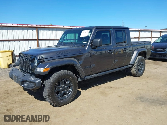 2023 Jeep Gladiator Sport S z VIN 1C6HJTAG2PL575276, wystawiony jako IAAI lot #42056473 z przebiegiem 17 043 mil mil oraz . Historia ofert i sprzedaży dostępna na DreamBid. Obrazek 2.