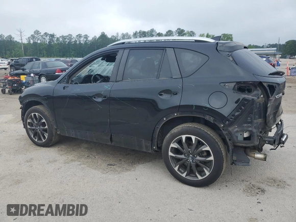2016 Mazda CX-5 Grand Touring z VIN JM3KE2DY5G0676290, wystawiony jako Copart lot #54155325 z przebiegiem 124 743 mil mil oraz Szkoda całkowita • Salvage title. Historia ofert i sprzedaży dostępna na DreamBid. Obrazek 2.