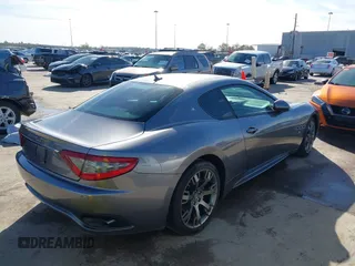 2013 Maserati GranTurismo Sport with VIN ZAM45VLA7D0074506, listed as a IAAI auction lot 41455462 with 34,292 mi miles. Bid and sale history available at carsss.com. Image 4.