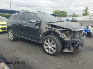 2013 Cadillac SRX Performance Collection with VIN 3GYFNDE33DS555717, listed as a Copart auction lot 53308195 with 125,528 mi miles and Salvage Title. Bid and sale history available at carsss.com. Image 4.