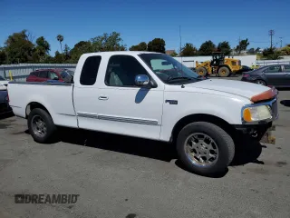 2002 Ford F-150 XL with VIN 1FTRX17212NA28461, listed as a Copart auction lot 63710665 with 185,460 mi miles and Salvage title. Bid and sale history available at DreamBid. Image 4.