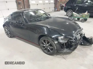 2020 Mazda MX-5 Miata Grand Touring z VIN JM1NDAM71L0411385, wystawiony jako IAAI lot #42051450 z przebiegiem 50 735 mil mil oraz . Historia ofert i sprzedaży dostępna na DreamBid. Obrazek 1.