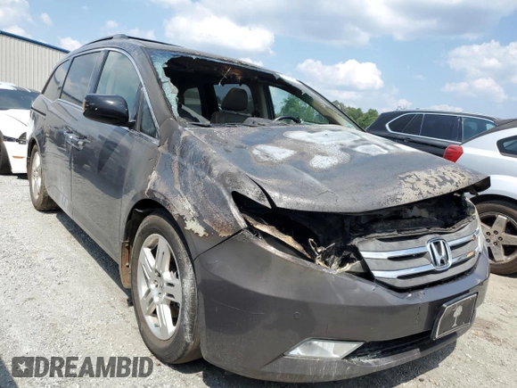 2011 Honda Odyssey Touring with VIN 5FNRL5H91BB045838, listed as a Copart auction lot 59612315 with Not provided miles and Salvage title. Bid and sale history available at DreamBid. Image 4.
