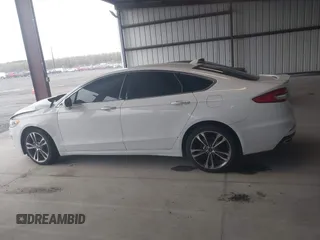2019 Ford Fusion Titanium with VIN 3FA6P0K95KR271291, listed as a IAAI auction lot 41983320 with 71,962 mi miles and . Bid and sale history available at DreamBid. Image 14.