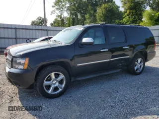 2011 Chevrolet Suburban LTZ with VIN 1GNSKKE38BR239478, listed as a Copart auction lot 59320955 with 117,476 mi miles and Salvage title. Bid and sale history available at DreamBid. Image 1.