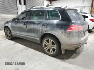 2011 Volkswagen Touareg Exec with VIN WVGFK9BP6BD006430, listed as a Copart auction lot 84288014 with 186,189 mi miles and Salvage Title. Bid and sale history available at DreamBid. Image 2.