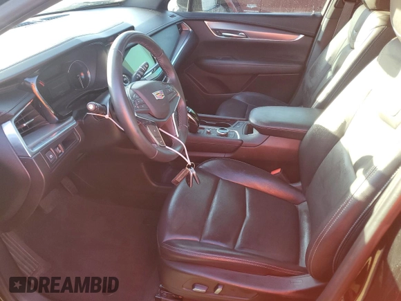 2022 Cadillac XT5 FWD Luxury z VIN 1GYKNAR49NZ159814, wystawiony jako Copart lot #74506584 z przebiegiem 7 069 mil mil oraz Nie do naprawy • Non repairable. Historia ofert i sprzedaży dostępna na DreamBid. Obrazek 7.