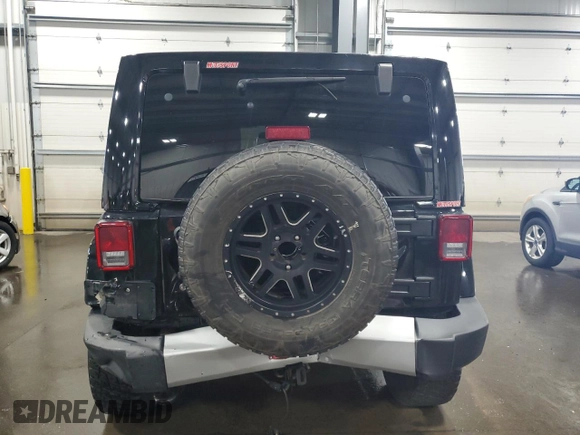 2012 Jeep Wrangler Unlimited Sahara with VIN 1C4BJWEG8CL235893, listed as a Copart auction lot 58195585 with 142,179 mi miles and Salvage title. Bid and sale history available at DreamBid. Image 6.
