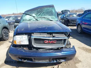 1999 GMC Jimmy SLE with VIN 1GKDT13W3X2553792, listed as a IAAI auction lot 41876489 with 266,884 mi miles. Bid and sale history available at carsss.com. Image 13.