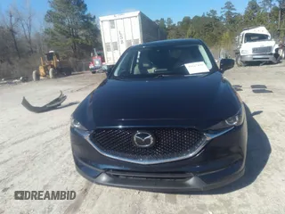 2020 Mazda CX-5 Touring with VIN JM3KFACM1L1817303, listed as a IAAI auction lot 41627859 with 57,268 mi miles. Bid and sale history available at carsss.com. Image 12.