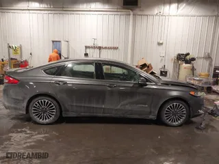 2018 Ford Fusion Hybrid Titanium with VIN 3FA6P0RU4JR147831, listed as a IAAI auction lot 41586033 with 101,088 mi miles. Bid and sale history available at carsss.com. Image 13.