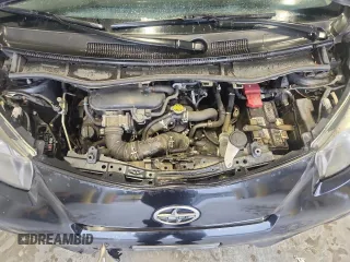 2012 Scion iQ z VIN JTNJJXB04CJ012587, wystawiony jako Copart lot #58191845 z przebiegiem 104 601 mil mil oraz Szkoda całkowita • Salvage title. Historia ofert i sprzedaży dostępna na DreamBid. Obrazek 11.