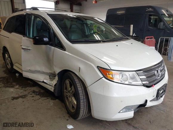2012 Honda Odyssey Touring with VIN 5FNRL5H96CB134466, listed as a IAAI auction lot 41895655 with 127,672 mi miles. Bid and sale history available at carsss.com. Image 1.