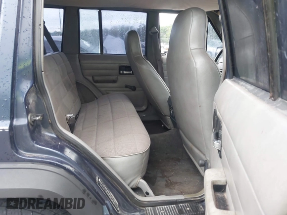 1996 Jeep Cherokee SE z VIN 1J4FJ28S5TL129065, wystawiony jako IAAI lot #42231133 z przebiegiem 225 320 mil mil oraz . Historia ofert i sprzedaży dostępna na DreamBid. Obrazek 8.