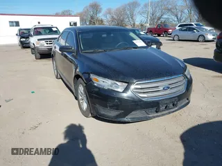 2013 Ford Taurus SE z VIN 1FAHP2D84DG215152, wystawiony jako IAAI lot #41971437 z przebiegiem 113 175 mil mil oraz . Historia ofert i sprzedaży dostępna na DreamBid. Obrazek 1.