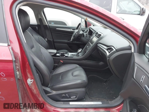 2016 Ford Fusion Titanium Hybrid with VIN 3FA6P0RU3GR355398, listed as a IAAI auction lot 41140669 with 125,959 mi miles. Bid and sale history available at carsss.com. Image 5.