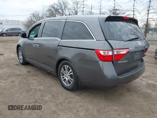 2012 Honda Odyssey EX-L with VIN 5FNRL5H65CB042898, listed as a IAAI auction lot 41784075 with 179,596 mi miles and . Bid and sale history available at carsss.com. Image 3.