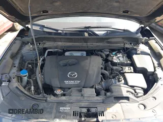 2017 Mazda CX-5 Touring z VIN JM3KFBCL5H0133493, wystawiony jako IAAI lot #39666644 z przebiegiem 125 048 mil mil oraz . Historia ofert i sprzedaży dostępna na DreamBid. Obrazek 10.