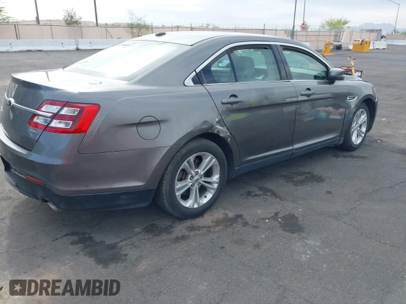 2013 Ford Taurus SEL with VIN 1FAHP2E82DG230831, listed as a IAAI auction lot 42078978 with 207,075 mi miles and . Bid and sale history available at carsss.com. Image 4.