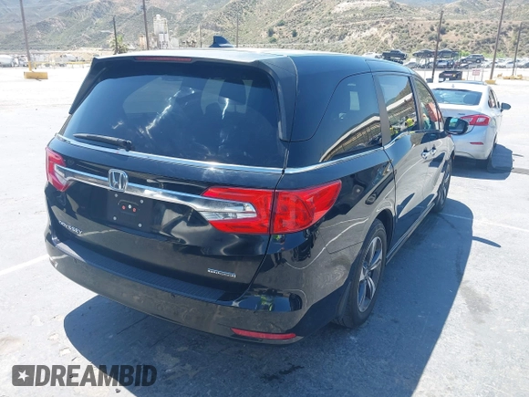 2018 Honda Odyssey Touring with VIN 5FNRL6H8XJB026247, listed as a IAAI auction lot 42298961 with 66,571 mi miles and . Bid and sale history available at DreamBid. Image 4.