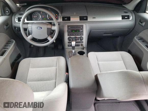 2005 Ford Five Hundred SE z VIN 1FAFP231X5G165841, wystawiony jako Copart lot #43117535 z przebiegiem 154 874 mil mil oraz Czysty tytuł • Clean title. Historia ofert i sprzedaży dostępna na DreamBid. Obrazek 8.