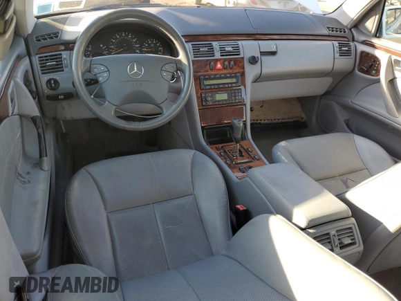 2000 Mercedes-Benz E-Class AWD with VIN WDBJF82G1YX028712, listed as a Copart auction lot 43983315 with 201,037 mi miles and Salvage Title. Bid and sale history available at carsss.com. Image 8.