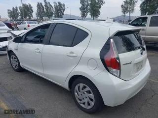 2015 Toyota Prius c One with VIN JTDKDTB3XF1097538, listed as a IAAI auction lot 42031057 with 100,847 mi miles. Bid and sale history available at carsss.com. Image 3.