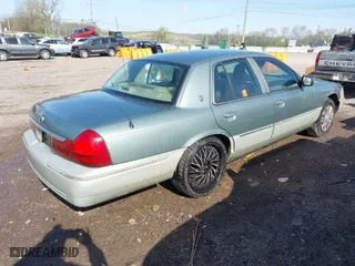 2005 Mercury Grand Marquis GS with VIN 2MEFM74W35X653175, listed as a IAAI auction lot 42005035 with 142,935 mi miles. Bid and sale history available at carsss.com. Image 4.