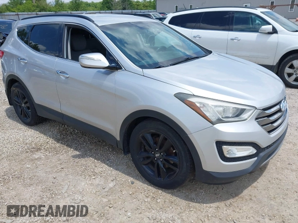 2013 Hyundai Santa Fe Sport z VIN 5XYZUDLA8DG055576, wystawiony jako IAAI lot #42392636 z przebiegiem 165 096 mil mil oraz . Historia ofert i sprzedaży dostępna na DreamBid. Obrazek 1.