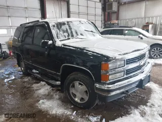 1999 Chevrolet Tahoe Z71 with VIN 1GNEK13R7XJ402254, listed as a IAAI auction lot 41597861 with 215,044 mi miles. Bid and sale history available at carsss.com. Image 1.