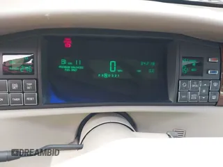 1996 Cadillac DeVille z VIN 1G6KF5298TU269234, wystawiony jako IAAI lot #41345945 z przebiegiem 34 218 mil mil oraz . Historia ofert i sprzedaży dostępna na DreamBid. Obrazek 7.