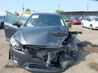 2016 Mazda CX-5 Sport with VIN JM3KE4BY7G0893984, listed as a IAAI auction lot 42479813 with Not provided miles and . Bid and sale history available at DreamBid. Image 13.