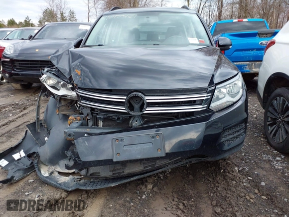 2015 Volkswagen Tiguan SE z VIN WVGBV7AXXFW612903, wystawiony jako IAAI lot #41017461 z przebiegiem 149 297 mil mil oraz . Historia ofert i sprzedaży dostępna na DreamBid. Obrazek 13.