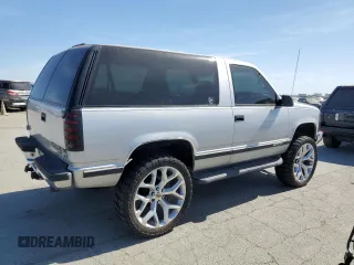 1997 Chevrolet Tahoe z VIN 3GNEK18R1VG112163, wystawiony jako Copart lot #58631925 z przebiegiem 213 262 mil mil oraz Tytuł czysty. Historia ofert i sprzedaży dostępna na DreamBid. Obrazek 3.
