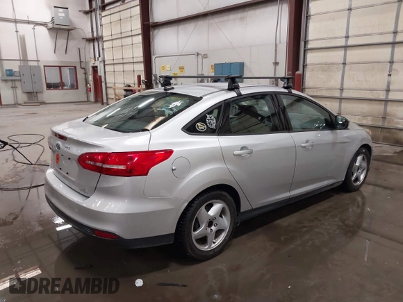 2015 Ford Focus SE with VIN 1FADP3F28FL231684, listed as a IAAI auction lot 41914284 with 100,195 mi miles. Bid and sale history available at carsss.com. Image 4.