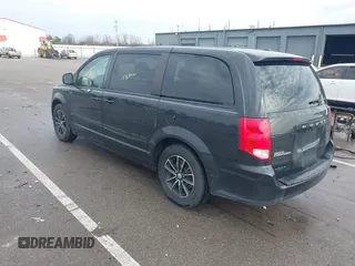 2015 Dodge Grand Caravan SE with VIN 2C4RDGBG8FR669355, listed as a IAAI auction lot 41486867 with 189,650 mi miles and . Bid and sale history available at DreamBid. Image 3.