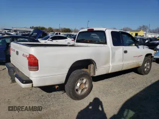 1999 Dodge Dakota SLT with VIN 1B7GG22Y6XS119274, listed as a Copart auction lot 46947005 with 264,537 mi miles and Salvage Title. Bid and sale history available at DreamBid. Image 3.