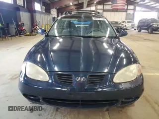 2000 Hyundai Elantra z VIN KMHJW35F5YU181324, wystawiony jako Copart lot #48016775 z przebiegiem 79 686 mil mil oraz Czysty tytuł • Clean title. Historia ofert i sprzedaży dostępna na DreamBid. Obrazek 5.