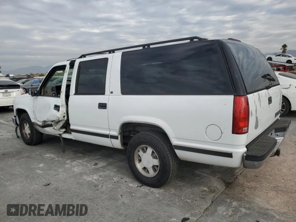 1996 Chevrolet Suburban with VIN 3GNEC16R5TG149147, listed as a Copart auction lot 84827204 with 320,305 mi miles and Salvage title. Bid and sale history available at DreamBid. Image 2.