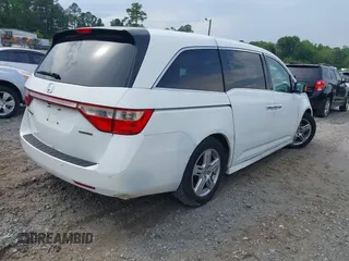 2011 Honda Odyssey Touring with VIN 5FNRL5H90BB066177, listed as a IAAI auction lot 42053368 with 239,205 mi miles and . Bid and sale history available at carsss.com. Image 4.