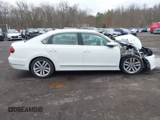 2017 Volkswagen Passat SE z VIN 1VWGT7A35HC052769, wystawiony jako IAAI lot #41687009 z przebiegiem 59 791 mil mil oraz . Historia ofert i sprzedaży dostępna na DreamBid. Obrazek 13.