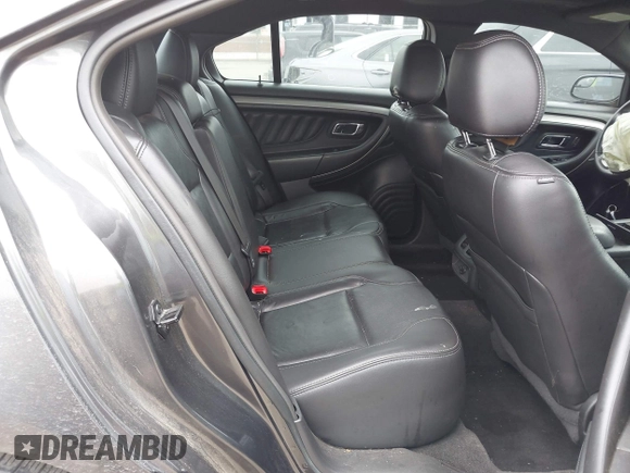 2015 Ford Taurus SEL z VIN 1FAHP2E81FG163058, wystawiony jako IAAI lot #42279778 z przebiegiem 127 957 mil mil oraz . Historia ofert i sprzedaży dostępna na DreamBid. Obrazek 8.
