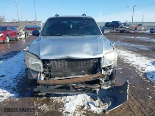 2010 Mercury Mariner with VIN 4M2CN8B72AKJ30465, listed as a IAAI auction lot 41554592 with 110,973 mi miles. Bid and sale history available at carsss.com. Image 13.