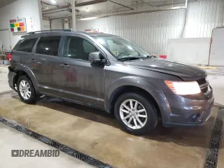 2016 Dodge Journey SXT with VIN 3C4PDDBG8GT242018, listed as a Copart auction lot 52899665 with 132,567 mi miles and Salvage Title. Bid and sale history available at DreamBid. Image 4.