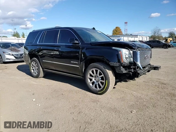 2016 GMC Yukon Denali with VIN 1GKS1CKJXGR329103, listed as a Copart auction lot 75492494 with 124,374 mi miles and Salvage Title. Bid and sale history available at carsss.com. Image 12.